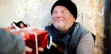 Homeless man receiving gift